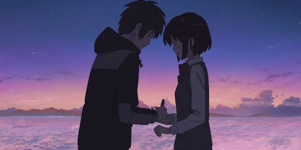 Taki écrit son nom sur la main de Mitsuha pour qu'ils ne s'oublient pas.